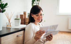Woman reading personalized direct mail letter